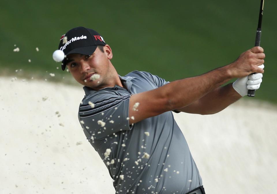 Jason Day of Australia chips out of a sand trap on the tenth green during his practice round ahead of the 2015 Masters at the Augusta National Golf Course in Augusta, Georgia April 6, 2015. REUTERS/Phil Noble