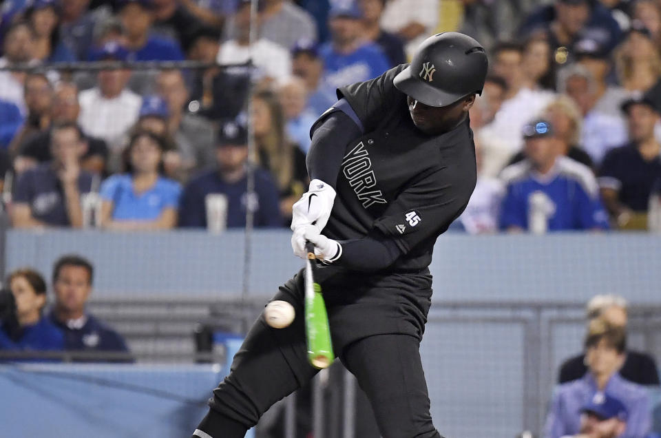 New York Yankees' Didi Gregorius hits a grand slam during the fifth inning of the team's baseball game against the Los Angeles Dodgers on Friday, Aug. 23, 2019, in Los Angeles. (AP Photo/Mark J. Terrill)