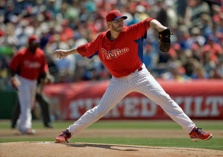 FILE PHOTO: Philadelphia Phillies starter Roy Halladay pitches against the Toronto Blue Jays during the first inning of a MLB spring training baseball game in Clearwater, Florida, March 28, 2013. REUTERS/Steve Nesius/File photo