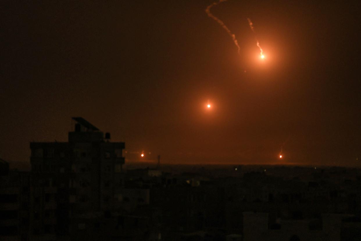 Flares fired by the Israeli army light up the sky east of Khan Yunis on the southern Gaza Strip on October 27, 2023 as battles between Israel and the Palestinian Hamas movement continue (AFP via Getty Images)