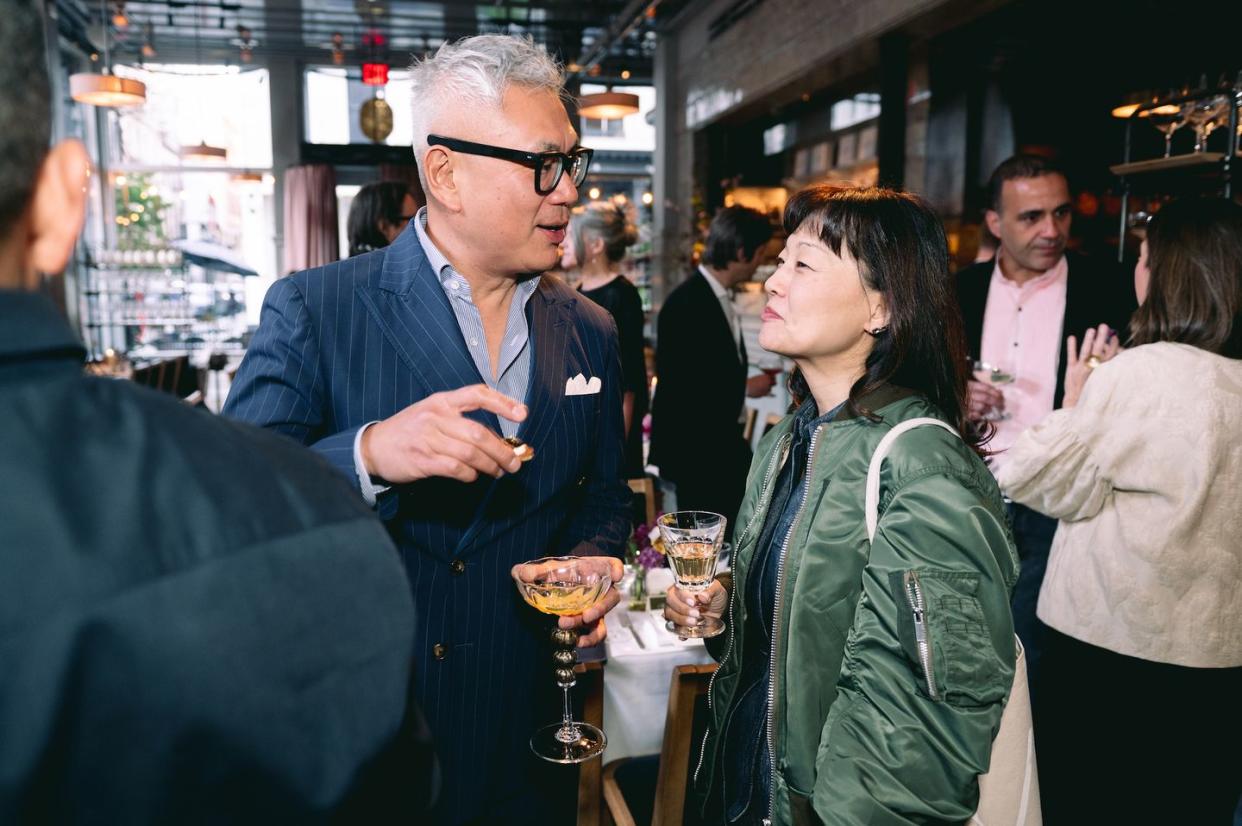 a man and woman talking to each other