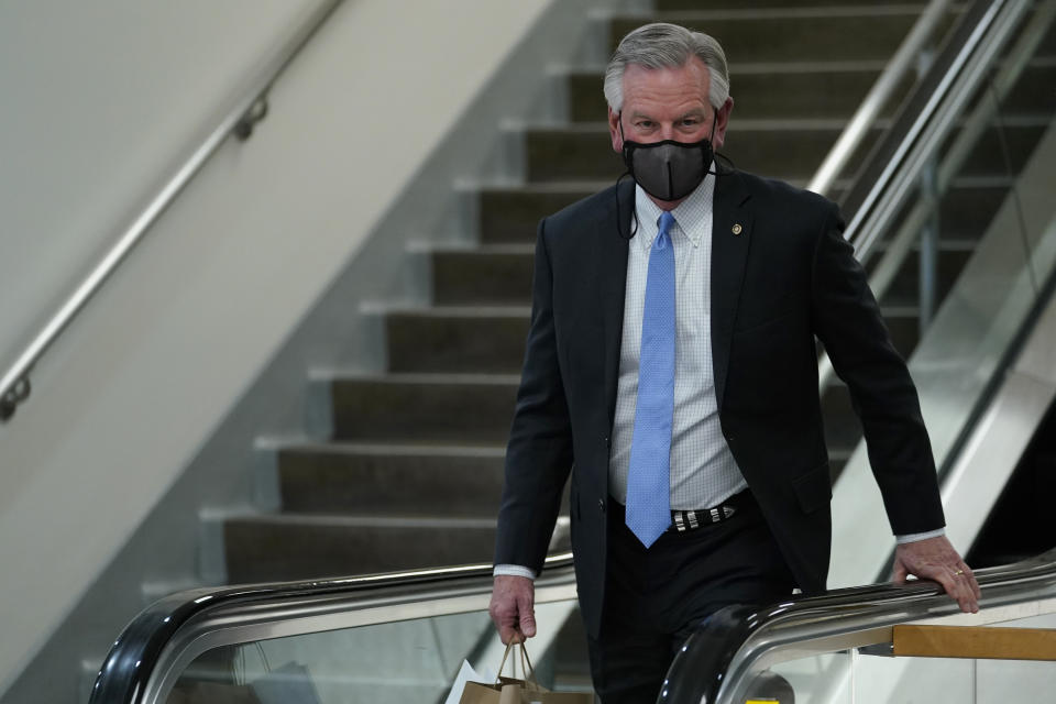 Sen. Tommy Tuberville, R-Ala., walks on Capitol Hill in Washington, Wednesday, Feb. 10, 2021, during a break on the second day of the second impeachment trial of former President Donald Trump. (AP Photo/Susan Walsh)