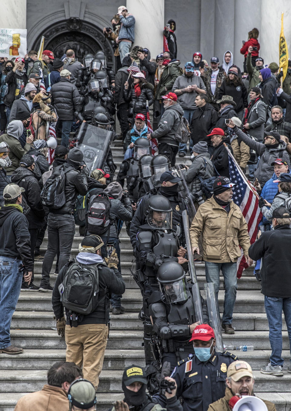 Capitol Police Officer Tarik Khalid Johnson, bottom, wears a 