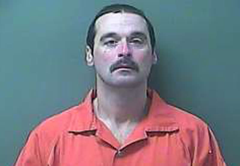 This Monday, Feb. 3, 2014 image provided by the LaPorte County Sheriff's office shows escaped prisoner Michael David Elliot. Elliot, a convicted killer who peeled a hole in two fences with his hands to escape from the Ionia Correctional Facility in western Michigan before abducting a woman and fleeing to Indiana was captured Monday evening after a chase, authorities said. (AP Photo/LaPorte County Sheriff's Office)