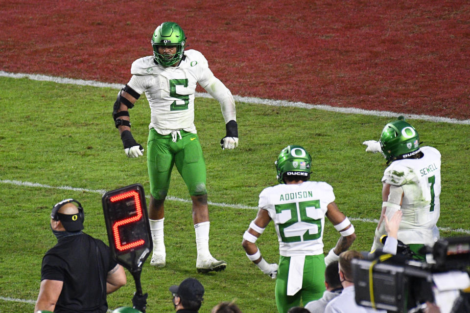 LOS ANGELES, CA - DECEMBER 18: Oregon Ducks defensive lineman Kayvon Thibodeaux (5) celebrates during the Pac-12 Championship college football game between the Oregon Ducks and the USC Trojans on December 18, 2020, at Los Angeles Memorial Coliseum in Los Angeles, CA. The game was played without fans due to the COVID-19 pandemic. (Photo by Brian Rothmuller/Icon Sportswire via Getty Images)