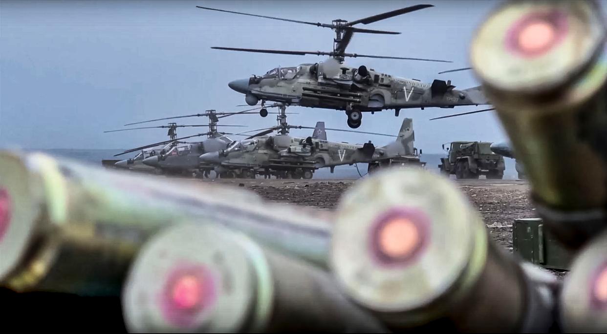 In this handout photo released by the Russian Defense Ministry Press Service released on Saturday, a KA-52 helicopter gunship takes off for a mission at an undisclosed location in Ukraine. (Russian Defense Ministry Press Service via AP)