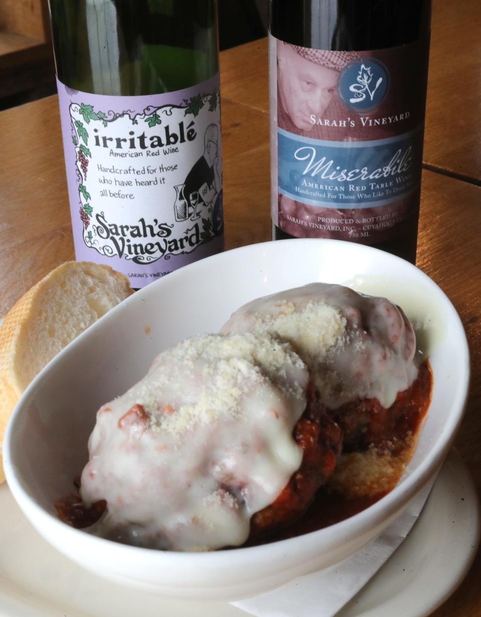 A bowl of meatballs are the perfect pairing for bottles of wine named Irritable and Miserabile  after Don Ross and Joe Lutz at Sarah's Vineyard on Wednesday, Nov. 17, 2021 in Cuyahoga Falls.