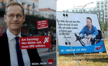 Election posters of top candidate of Social Democratic Party (SPD) and Mayor of Berlin Michael Mueller (L) and top candidate of the anti-immigration party Alternative for Germany (AfD) Georg Pazderski for the upcomming local city elections are pictured in Berlin, Germany, September 14, 2016. REUTERS/Fabrizio Bensch/File Photo