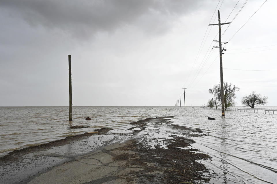 Southbound Dairy Avenue disappears beneath extensive flooding near Corcoran, Calif., on Wednesday, March 22, 2023. (Eric Paul Zamora/The Fresno Bee via AP)