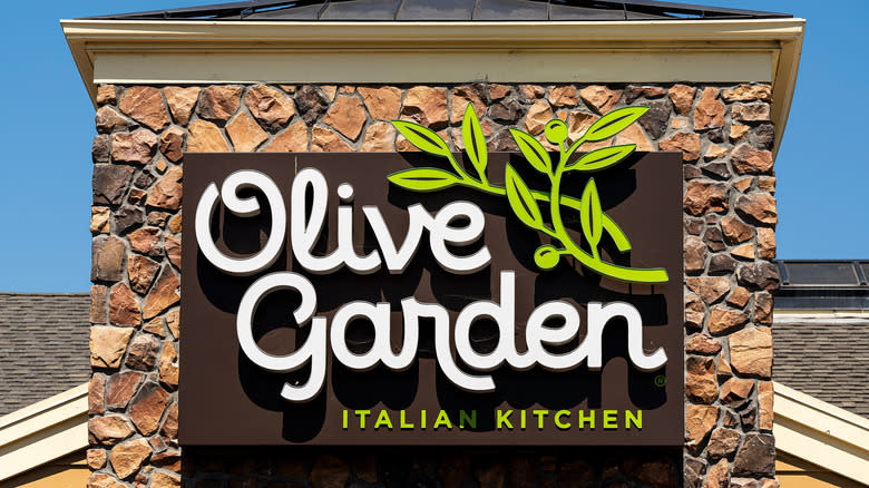 Olive Garden sign on stone wall