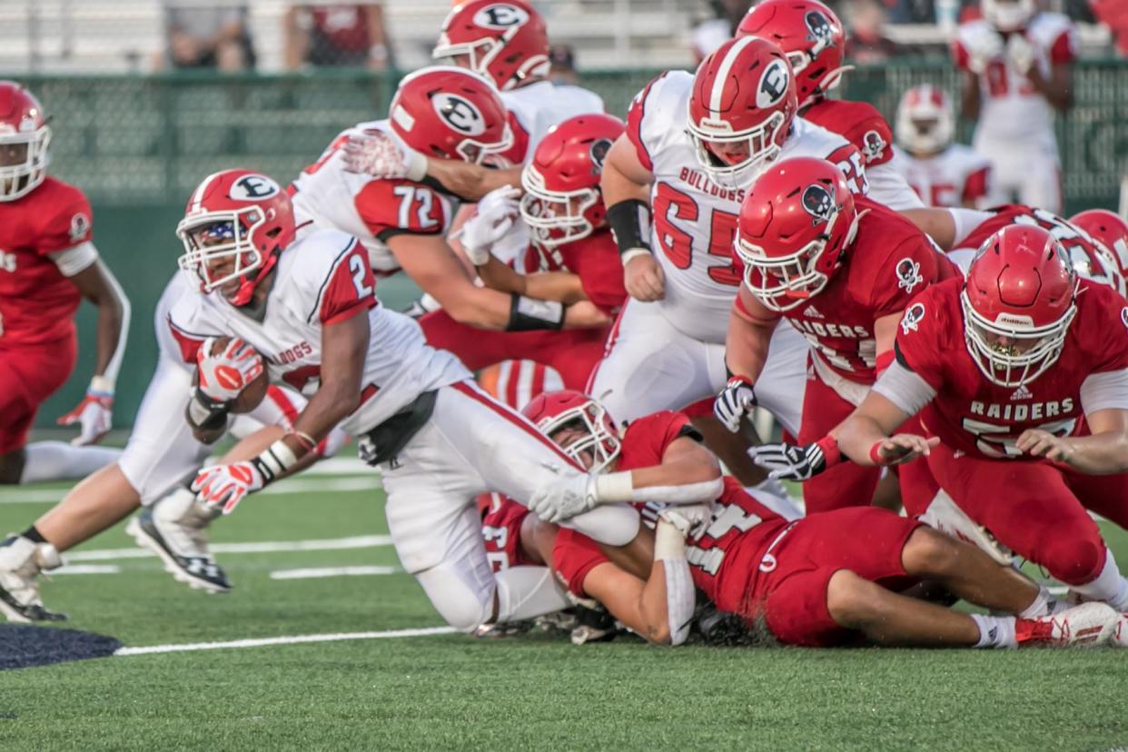 Savannah Christian's Peyton Cromwell brings down ECI running back Takyle Foreman during the Raiders' season opener Sept. 4 at Pooler Stadium. Savannah Christian won 38-14.