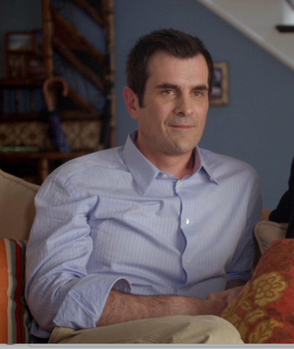 Ty Burrell as Phil Dunphy sits with Claire in "Modern Family"