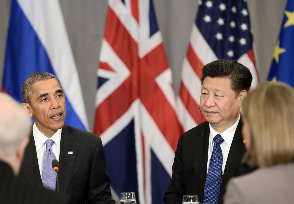China's President Xi Jinping (R) listens to US President Barack Obama (L) in a P5+1 meeting during the Nuclear Security Summit at the Walter E. Washington Convention Center on April 1, 2016 in Washington, DC.  / AFP / STEPHANE DE SAKUTIN        (Photo credit should read STEPHANE DE SAKUTIN/AFP via Getty Images)
