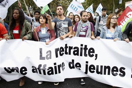 Protesters take part in a demonstration over pension reforms in Paris, September 10, 2013. REUTERS/Charles Platiau