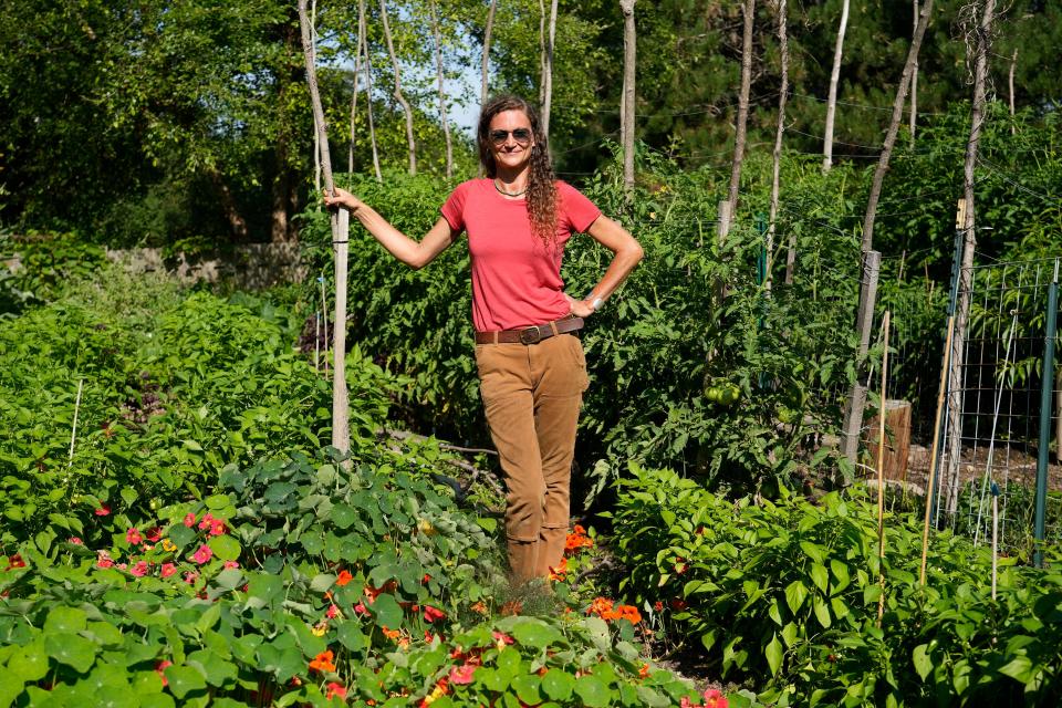 Melisa Hanson, owner of Baby Mama Botanicals, in her garden.