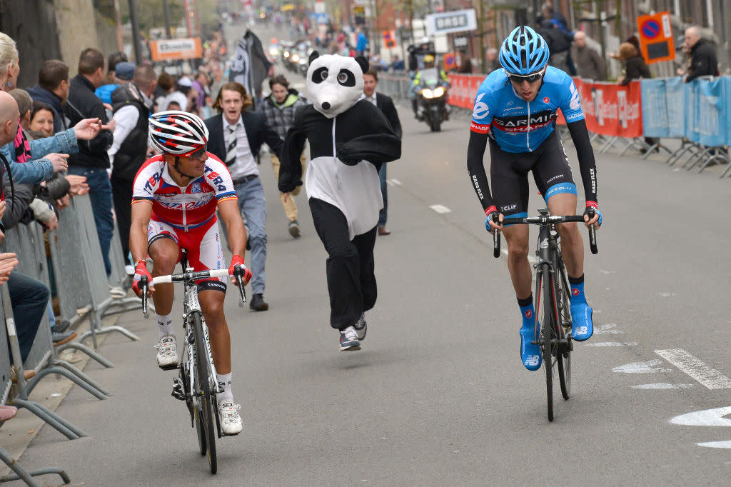  Dan Martin (right) is chased by a panda as he heads for victory at Liège-Bastogne-Liège in 2013 