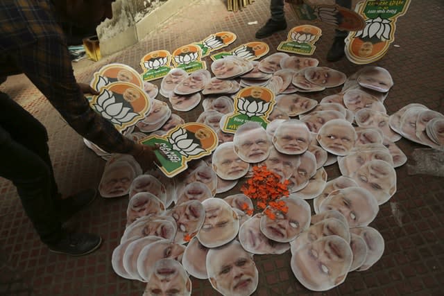 India’s opposition Bharatiya Janata Party workers prepare to distribute election campaign material in Jammu