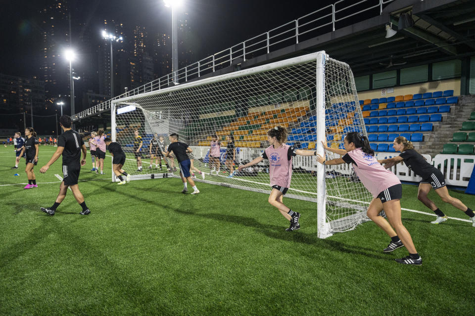 Women's seven-a-side team train in Happy Valley ahead of the Gay Games in Hong Kong, Tuesday, Oct. 31, 2023. Set to launch on Friday, Nov. 3, 2023, the first Gay Games in Asia are fostering hopes for wider LGBTQ+ inclusion in the Asian financial hub. (AP Photo/Chan Long Hei)