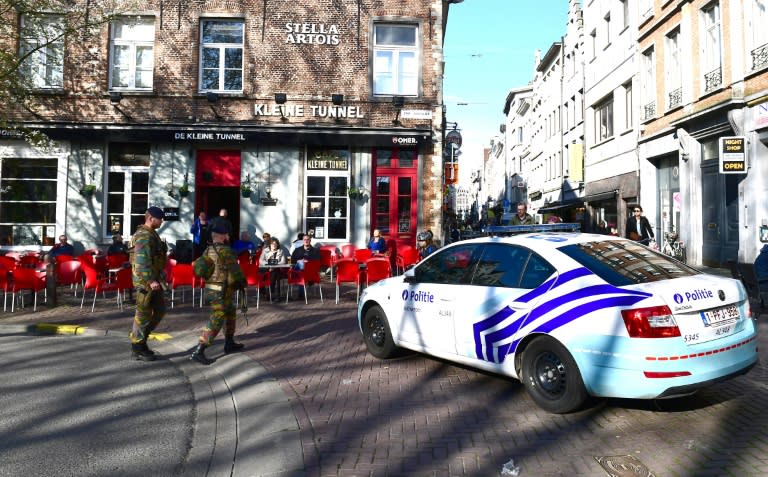 A police car blocks access to the Meir, Antwerp's main pedestrian street, after a man was arrested after he tried to drive into a crowd of shoppers at high speed on the street, on March 23, 2017