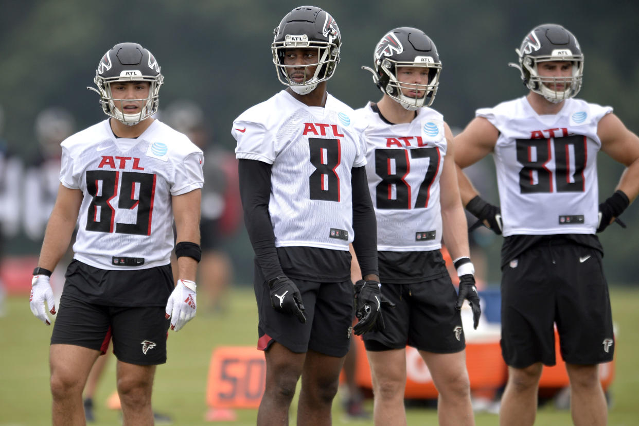 FJohn Raine #89, Kyle Pitts #8, Jaeden Graham #87, and Ryan Becker #80 of the Atlanta Falcons 