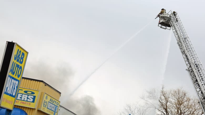 Auto shop owner could only watch as business burned