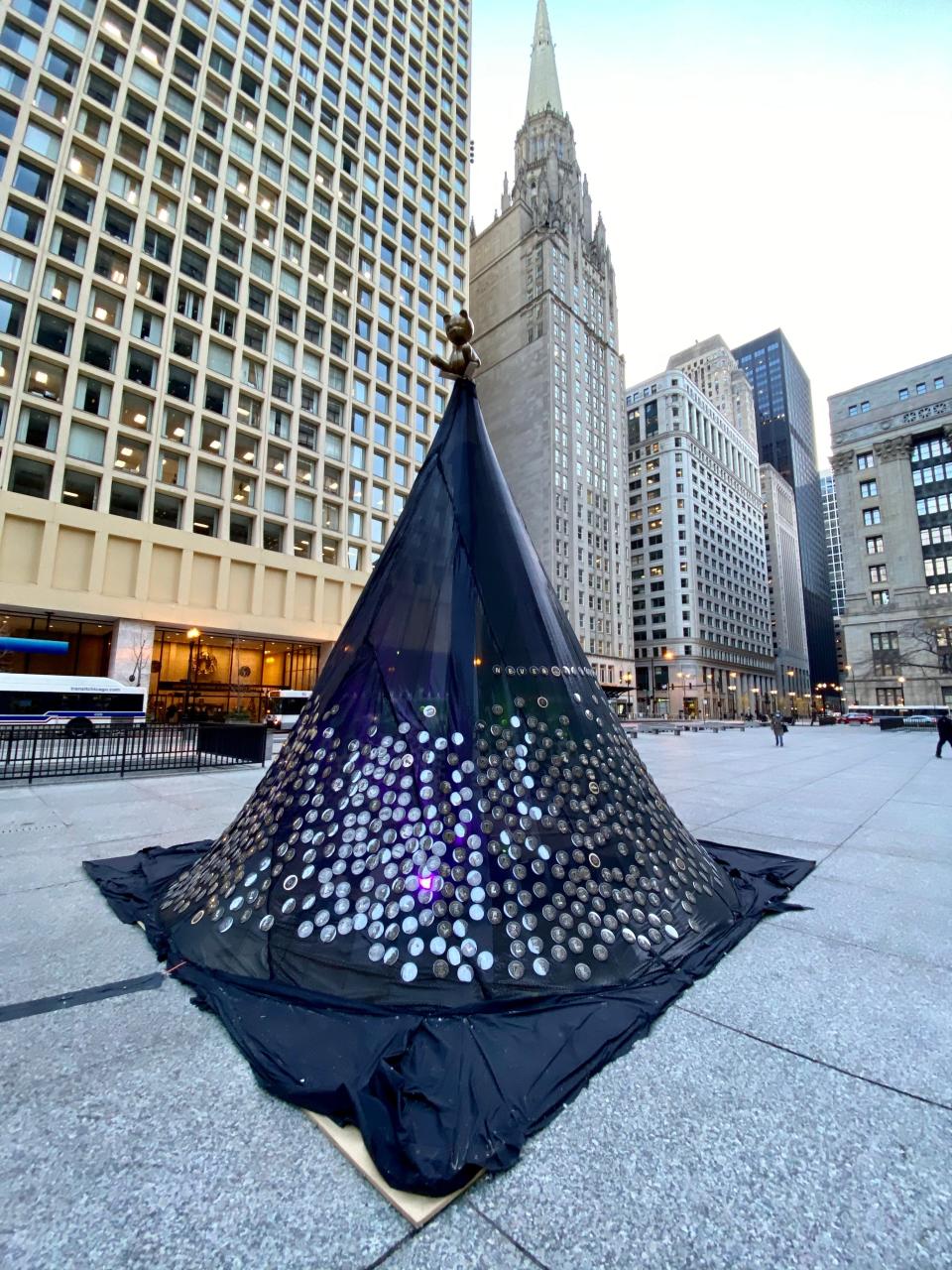 Ornaments bearing the names and images of Chicagoans killed in gun violence hang on the Tree of Remembrance at Daley Plaza in Chicago on Dec. 14, 2020.