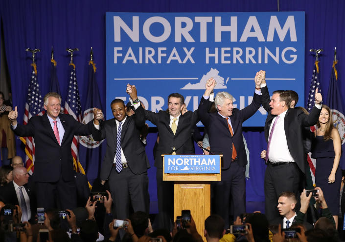 <span class="s1">Gov.-elect Ralph Northam, center, links arms with current Gov. Terry McAuliffe, Lt. Gov.-elect Justin Fairfax, Attorney General Mark Herring and U.S. Sen. Mark Warner at an election night rally. (Photo: Win McNamee/Getty Images)</span>