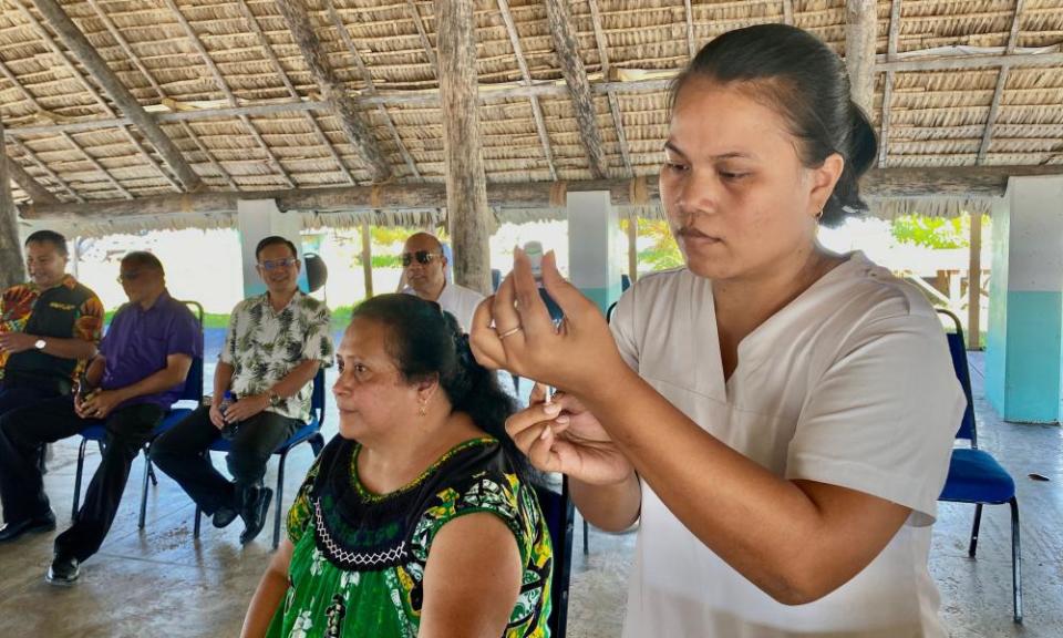 A health worker readies a Covid vaccine in Tarawa, Kiribati