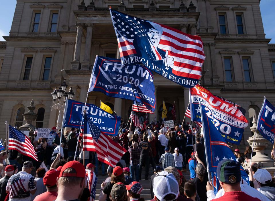 Supporters of US President Donald Trump rally at the State Capitol in Lansing, Michigan, on November 7, 2020, after Democratic Presidential nominee Joe Biden was declared the winner of the 2020 US elections.