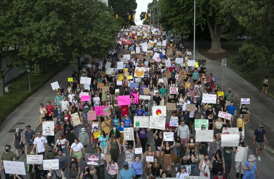 People gather to protest against the the Supreme Court's decision in the Dobbs v Jackson Women's Health case on June 24, 2022 in Raleigh, North Carolina