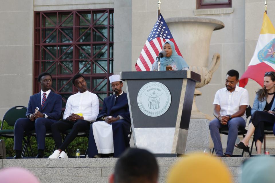 Hafsa Ahmed, a Columbus-based poet, reads from her composition “The Beauty of Being Somali" at the Somali Independence Day ceremony at Columbus City Hall on Thursday.