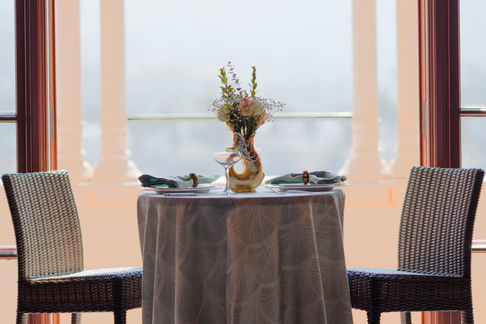 A table and two chairs on the veranda inside the Catalina Casino.