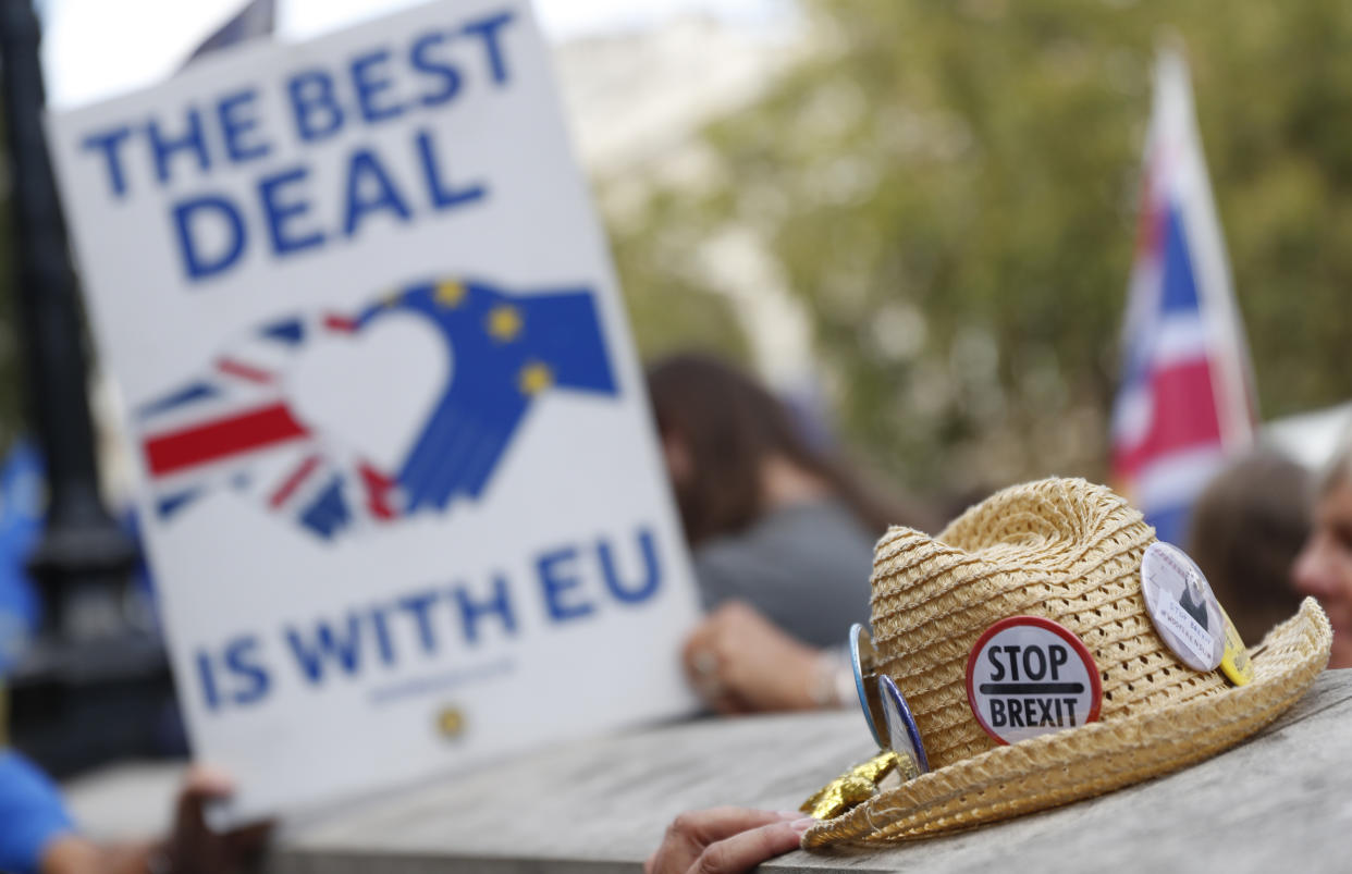 Anti Brexit demonstrators protest outside the Cabinet Office in central London, Thursday, Aug. 29, 2019. Political opposition to Prime Minister Boris Johnson's move to suspend Parliament is crystalizing, with protests around Britain and a petition to block the move gaining more than 1 million signatures. (AP Photo/Alastair Grant)