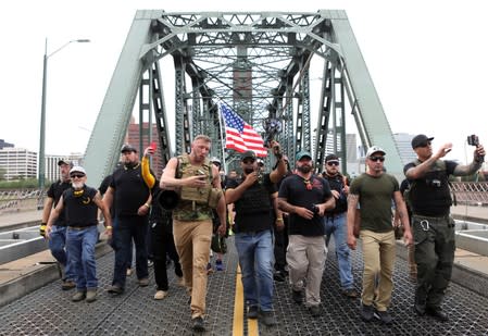 Members of the Proud Boys and their supporters march during a rally in Portland, Oregon