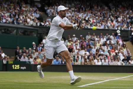 Britain Tennis - Wimbledon - All England Lawn Tennis & Croquet Club, Wimbledon, England - 4/7/16 USA's Steve Johnson in action against Switzerland's Roger Federer REUTERS/Andrew Couldridge