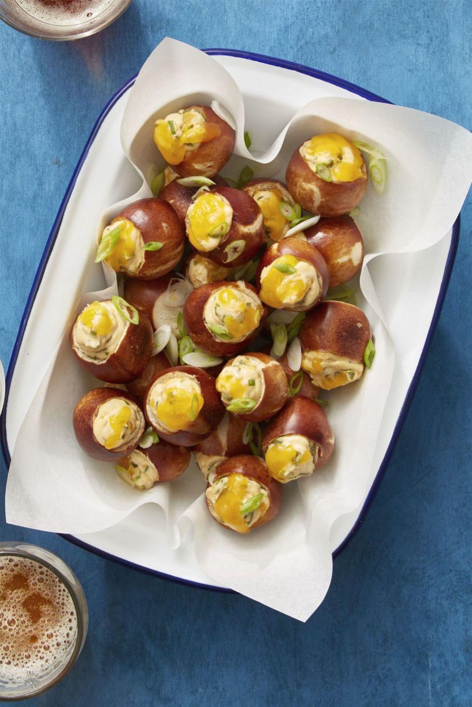 <p>Stuffed with a spicy, cheesy, cream cheese spread, these bites will absolutely win with everyone on game day.</p><p>Get the <a href="https://www.womansday.com/food-recipes/food-drinks/recipes/a61041/cheesy-jalapeno-pretzel-bites-recipe/" rel="nofollow noopener" target="_blank" data-ylk="slk:Cheesy Jalapeño Pretzel Bites recipe;elm:context_link;itc:0;sec:content-canvas" class="link "><strong>Cheesy Jalapeño Pretzel Bites recipe</strong></a> from Woman's Day. </p>