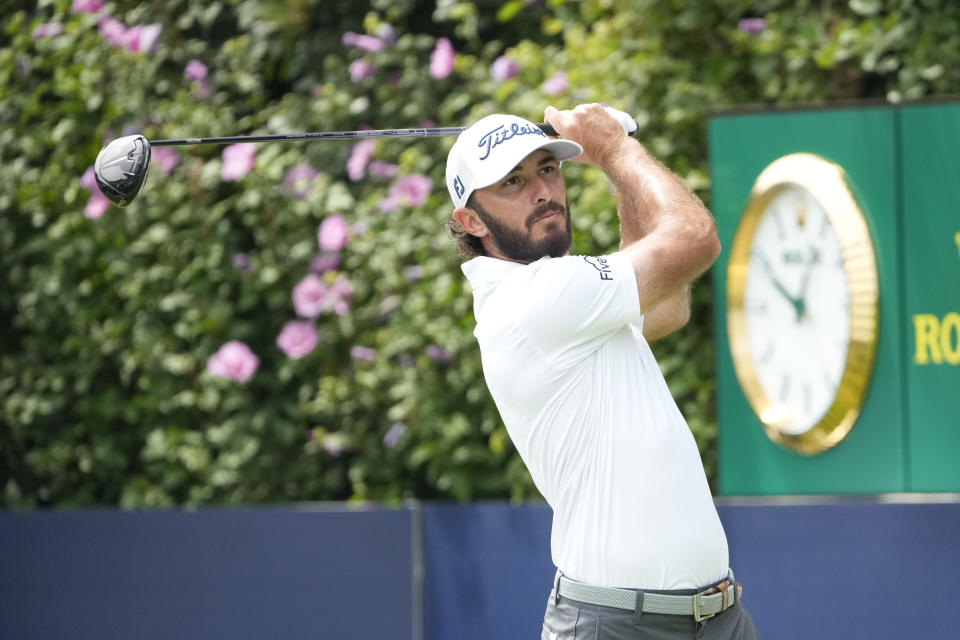 Max Homa watches his tee shot on the first hole during the third round of the BMW Championship golf tournament, Saturday, Aug. 19, 2023, in Olympia Fields, Ill. (AP Photo/Charles Rex Arbogast)