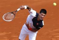 Novak Djokovic of Serbia serves to Albert Montanes of Spain during the Monte Carlo Masters in Monaco April 15, 2014. REUTERS/Eric Gaillard