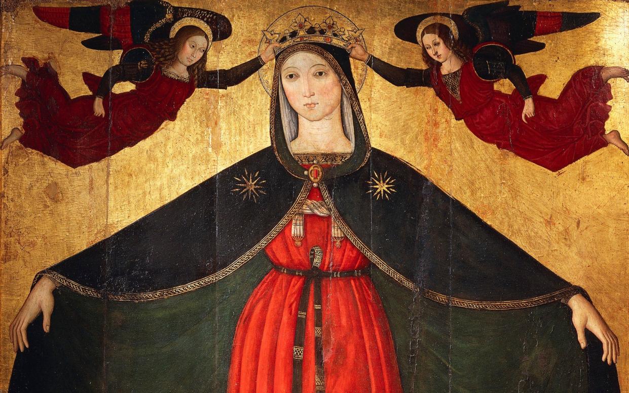 The Virgin Mary holds open her protecting cloak on a panel from 1500 at Orte in Italy - www.bridgemanimages.com