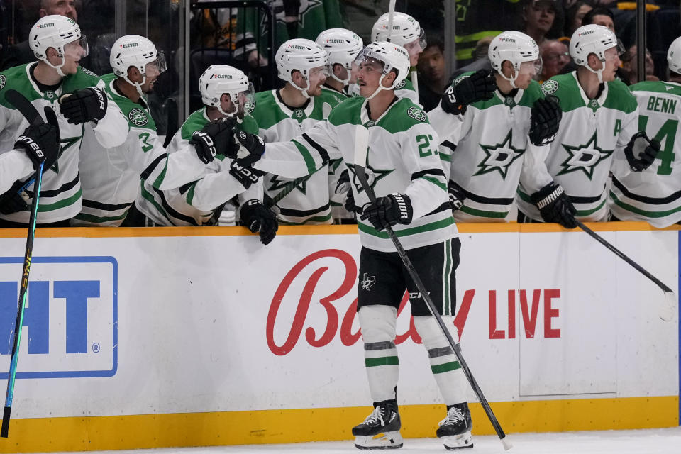 Dallas Stars left wing Mason Marchment (27) celebrates his goal with teammates during the second period of an NHL hockey game Nashville Predators, Thursday, Oct. 10, 2024, in Nashville, Tenn. (AP Photo/George Walker IV)