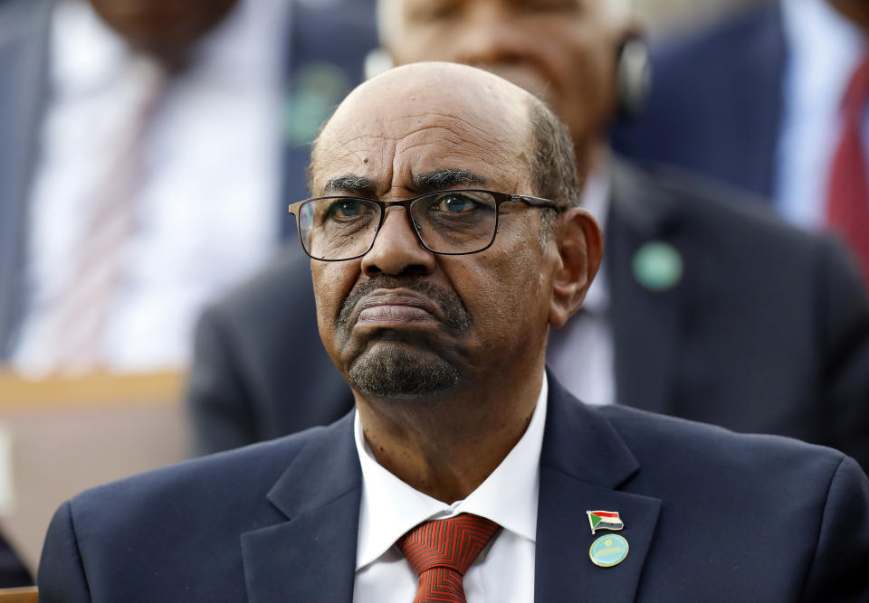 FILE - Sudan's President Omar al-Bashir attends a ceremony for Turkey's President Recep Tayyip Erdogan, at the Presidential Palace, July 9, 2018, in Ankara, Turkey. Ousted Sudanese strongman Omar al-Bashir was charged by the International Criminal Court on allegations including genocide in his country's Darfur region. (AP Photo/Burhan Ozbilici, File)