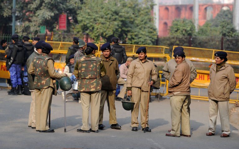 Indian women police stand guard at Jantar Mantar during a protest against a gang rape in New Delhi on January 6, 2013. Five men charged with the brutal gang-rape and murder of a student in New Delhi will appear in court for the first time Monday after police said they had forensic evidence to link to them to the killing