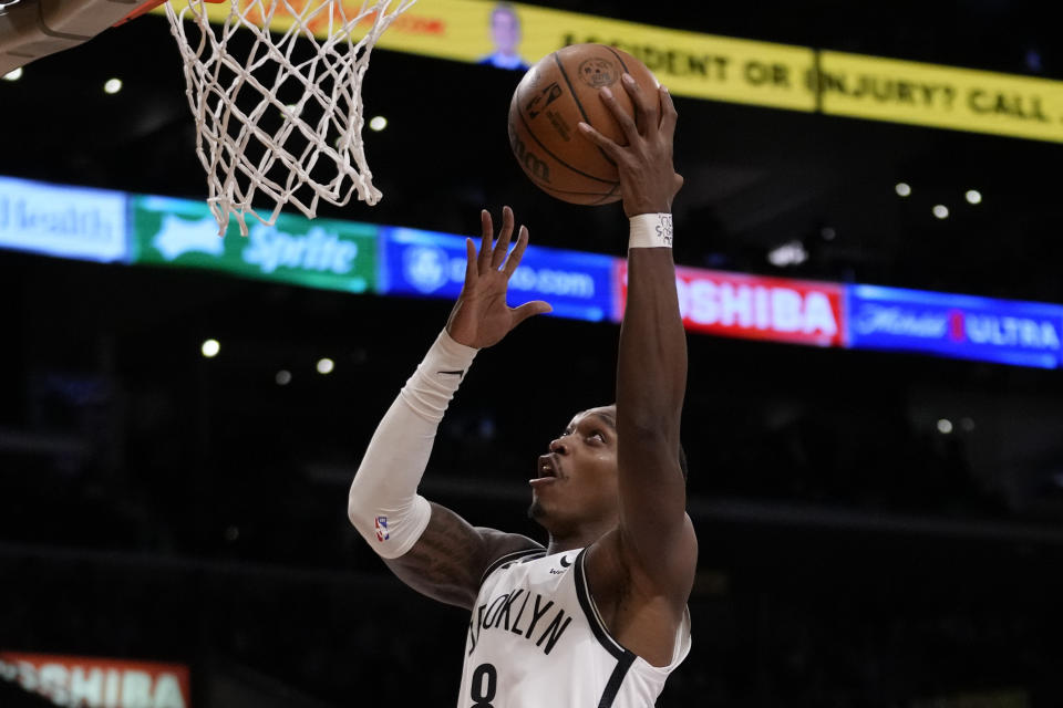 Brooklyn Nets guard Lonnie Walker IV (8) shoots during the first half of an NBA basketball game against the Los Angeles Lakers in Los Angeles, Friday, Jan. 19, 2024. (AP Photo/Ashley Landis)