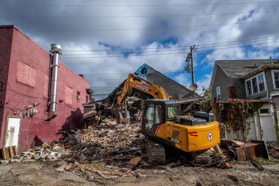 A crew from Diversified Demolition demolishes the former Brooking’s restaurant near the corner of Euclid and Woodland avenues in Lexington, Ky., on Tuesday, Oct. 26, 2021. Brookings used to serve a chili Adolph Rupp made famous.