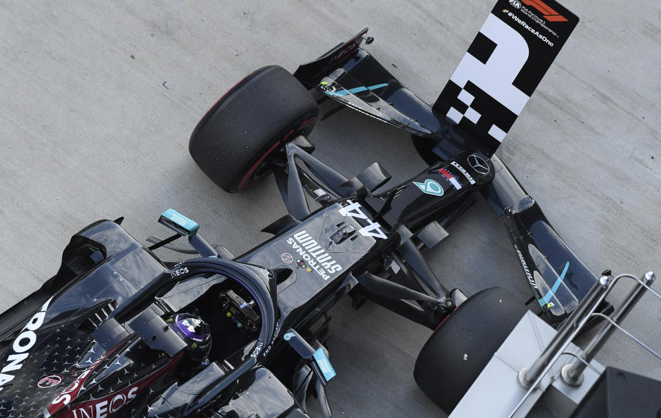 Mercedes driver Lewis Hamilton of Britain after taking pole position during the qualifying session for the upcoming Russian Formula One Grand Prix, at the Sochi Autodrom circuit, in Sochi, Russia, Saturday, Sept. 26, 2020. The Russian Formula One Grand Prix will take place on Sunday. (Kirill Kudryavtsev, Pool via AP)