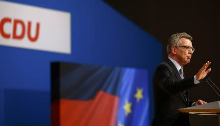 German Interior Minister Thomas de Maiziere addresses the Christian Democratic Union (CDU) party congress in Karlsruhe, Germany December 14, 2015. REUTERS/Kai Pfaffenbach