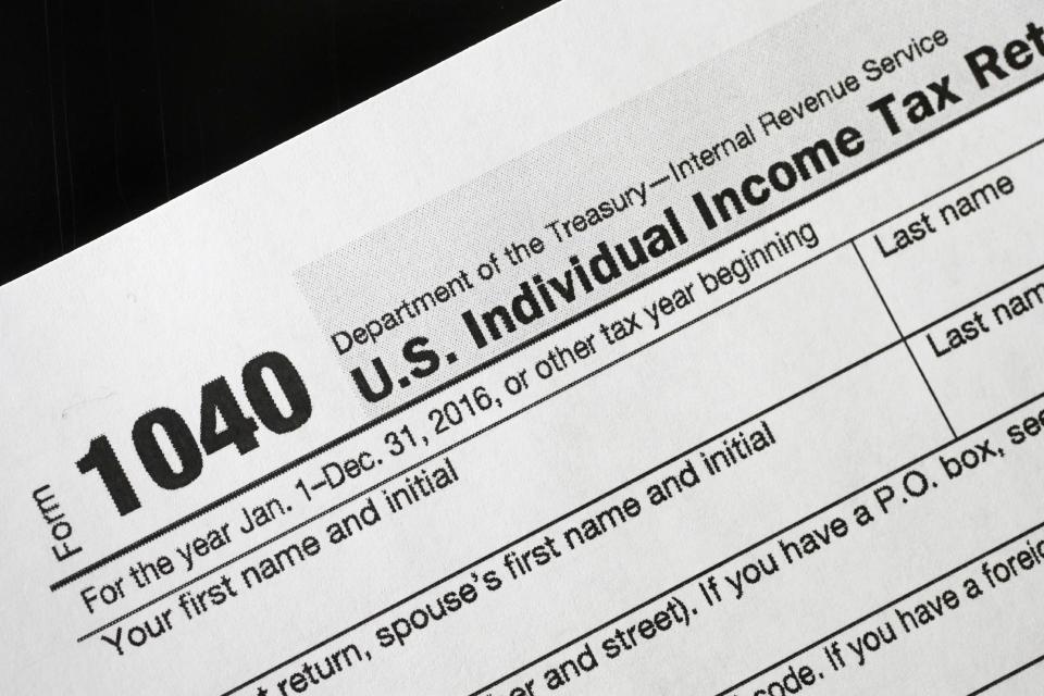 A 1040 tax form appears on display, Tuesday, Jan. 10, 2017, in New York. (AP Photo/Mark Lennihan)