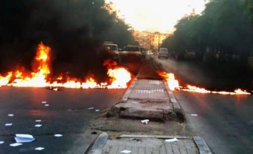 A Shaam News Network image is said to show a street blocked with burning tires during an anti-regime demonstration in Damascus on Thursday. UN chief Ban Ki-moon has warned that Syria risks a "catastrophic civil war" following a massacre that sparked global outrage, as the US slammed Russia for resisting UN action against Damascus