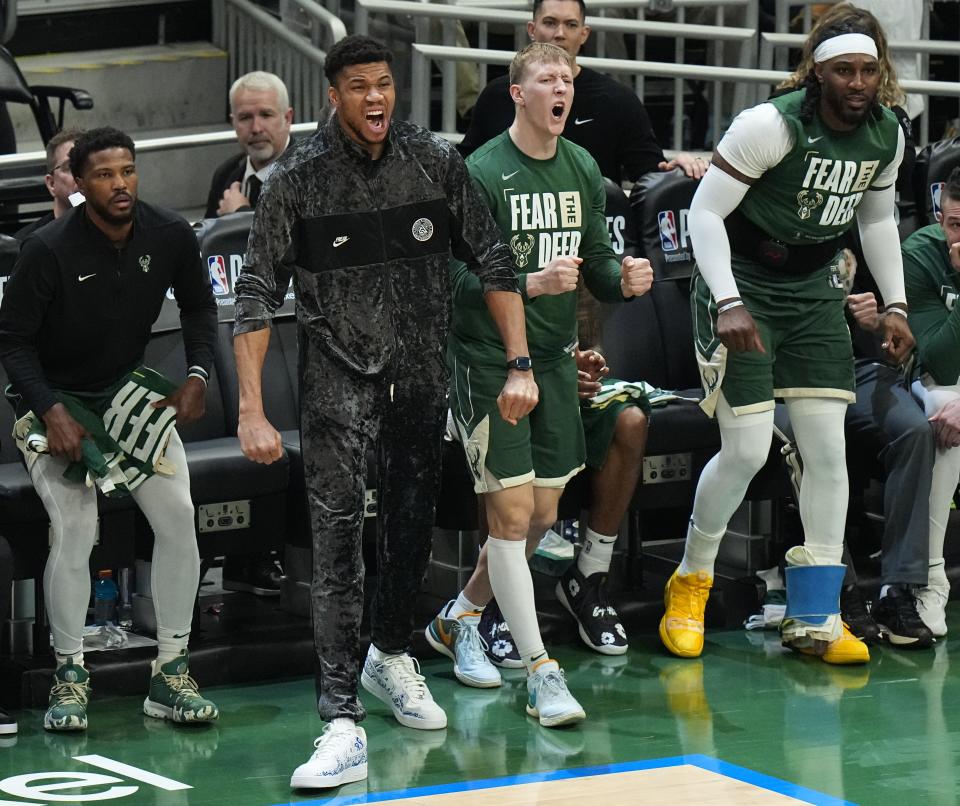 Injured Bucks forward Giannis Antetokounmpo cheers for his team during a playoff game last week against the Pacers.