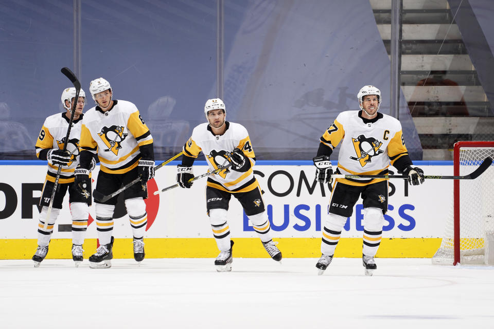 Jake Guentzel #59, John Marino #6, Conor Sheary #43 and Sidney Crosby #87 of the Pittsburgh Penguins